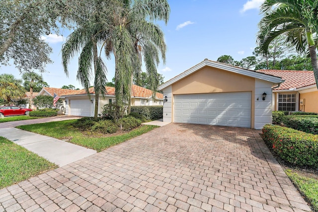 single story home featuring a garage