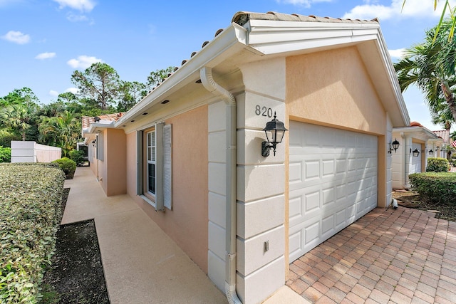 view of property exterior featuring a garage