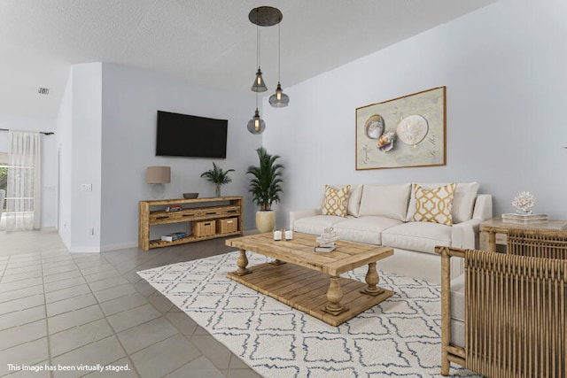 tiled living room featuring a textured ceiling