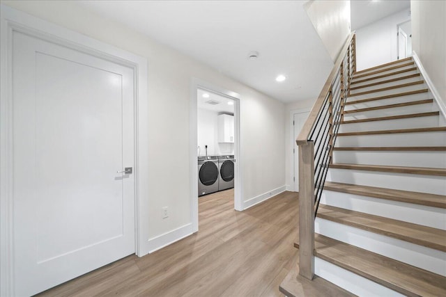 stairs featuring recessed lighting, baseboards, independent washer and dryer, and wood finished floors