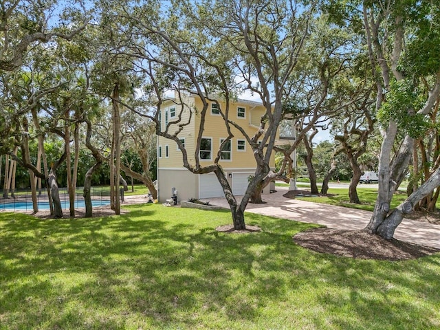 exterior space with a garage and a front yard