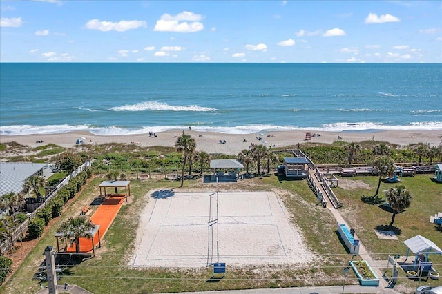 birds eye view of property featuring a view of the beach and a water view