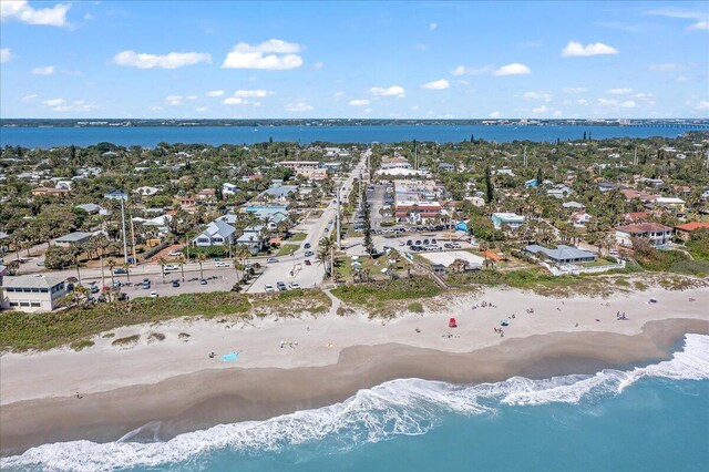 bird's eye view with a water view, a residential view, and a view of the beach