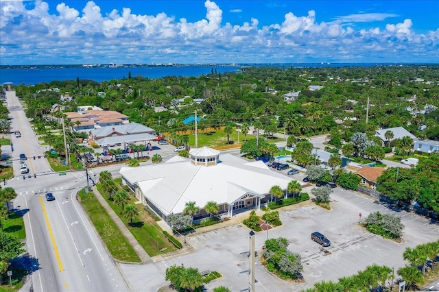 drone / aerial view with a water view and a residential view