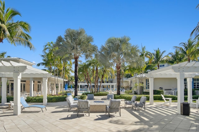 view of patio featuring a fire pit and a pergola