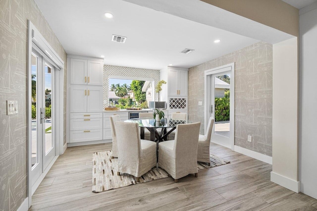 dining space featuring light hardwood / wood-style floors