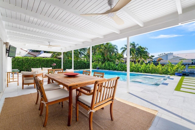 view of patio / terrace featuring a swimming pool with hot tub and ceiling fan