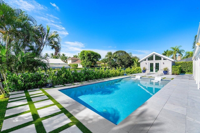 view of swimming pool with a patio