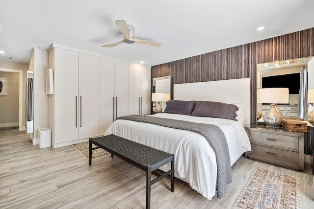 bedroom featuring light hardwood / wood-style flooring and ceiling fan