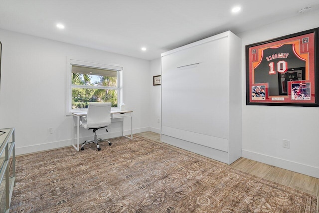 office space with hardwood / wood-style floors