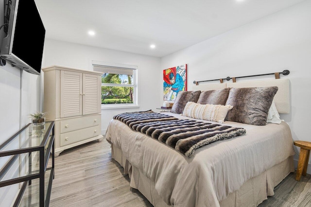 bedroom with light hardwood / wood-style flooring