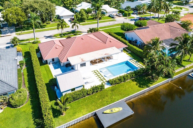 birds eye view of property with a water view