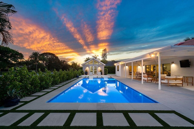 view of pool featuring outdoor lounge area and a patio area