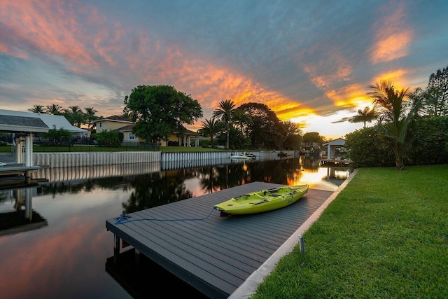 exterior space featuring a yard and a water view