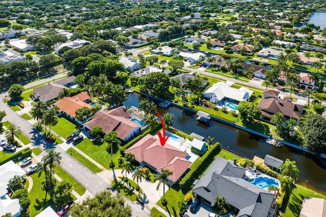 birds eye view of property featuring a water view