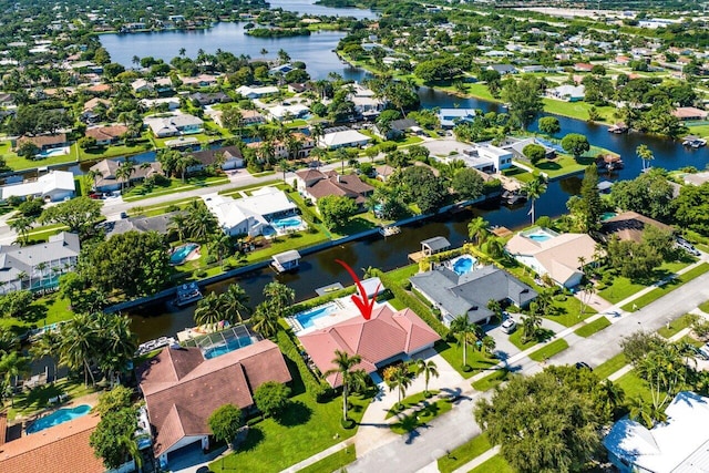 birds eye view of property with a water view