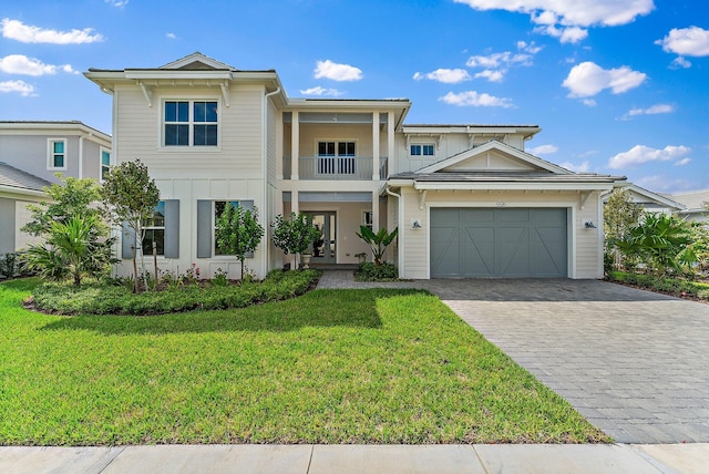 view of front of property with a front yard and a balcony