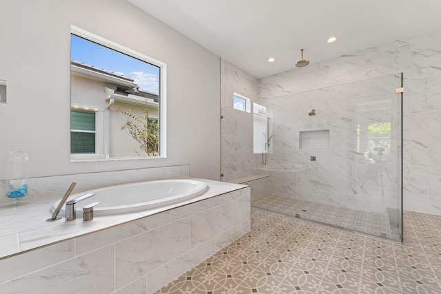 bathroom featuring tile patterned flooring and plus walk in shower