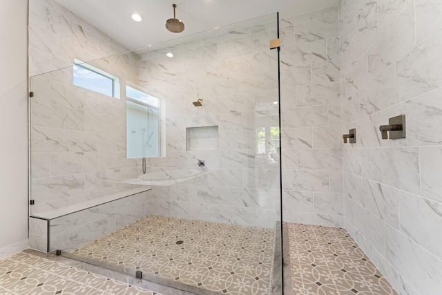 bathroom featuring a tile shower