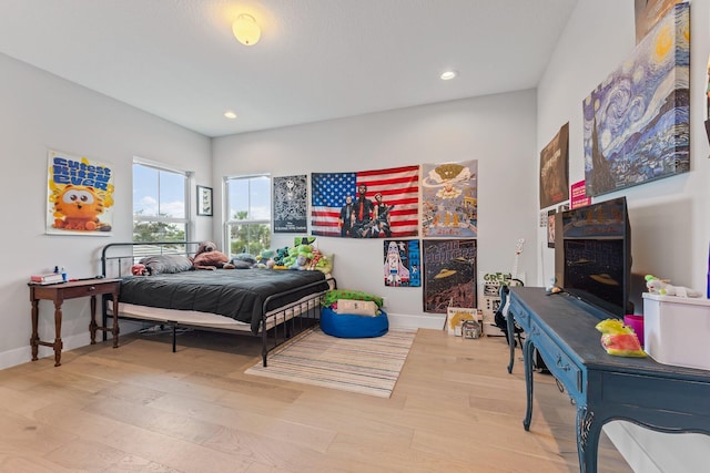 bedroom with light wood-type flooring