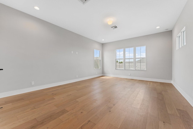 empty room with light hardwood / wood-style floors