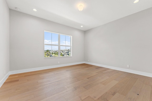 unfurnished room featuring light wood-type flooring