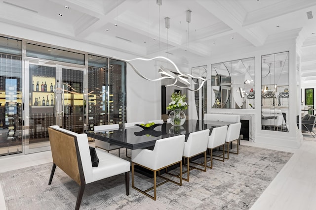 dining room with crown molding, beam ceiling, and coffered ceiling