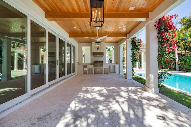 view of patio / terrace with ceiling fan and area for grilling