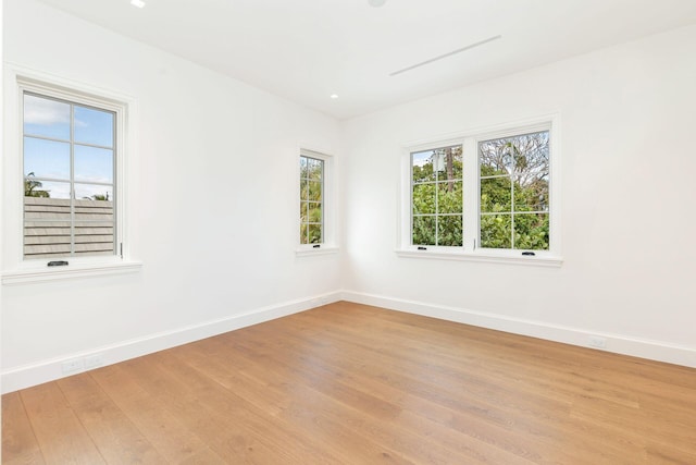 spare room featuring light hardwood / wood-style flooring