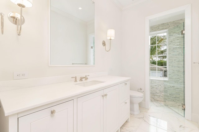 bathroom with a shower with door, crown molding, vanity, and toilet