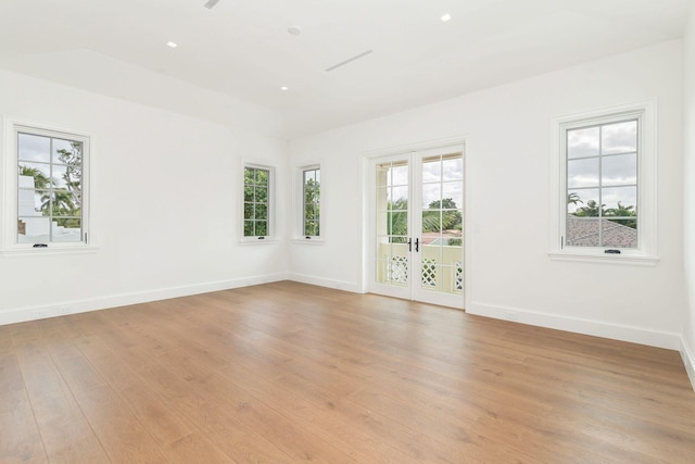 unfurnished room with light hardwood / wood-style flooring and french doors