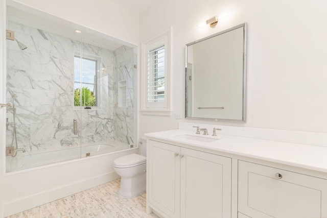 full bathroom with toilet, vanity, and combined bath / shower with glass door