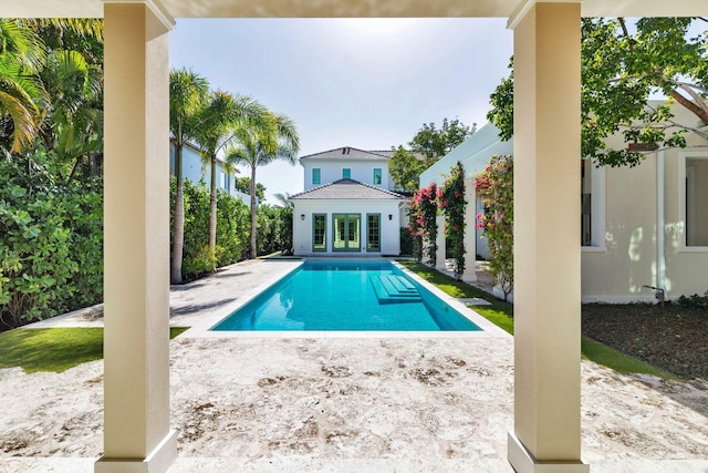 view of pool featuring a patio area and an outbuilding