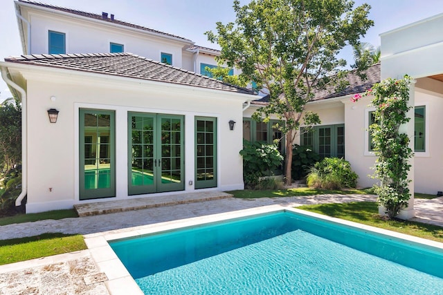 back of property featuring french doors