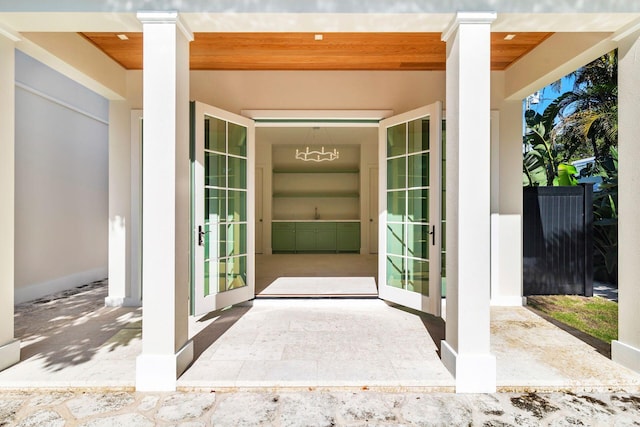 property entrance featuring french doors