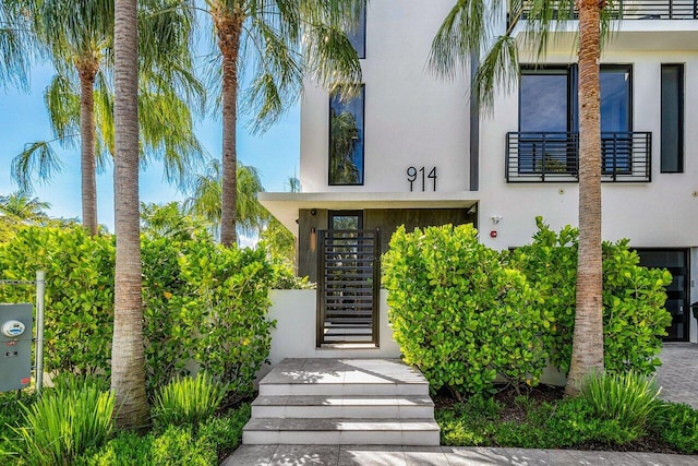 doorway to property featuring a balcony