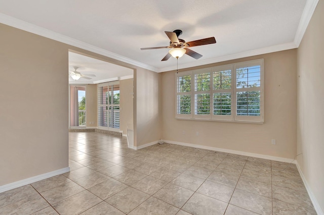 tiled spare room with ceiling fan and ornamental molding