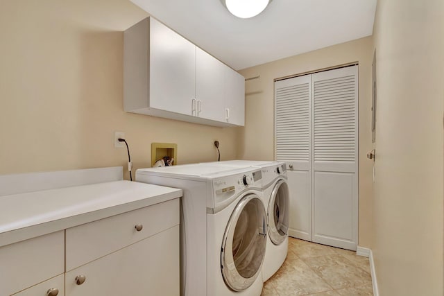 laundry area with cabinets and separate washer and dryer