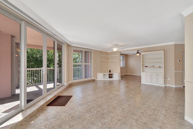 unfurnished living room featuring built in shelves, ceiling fan, and crown molding