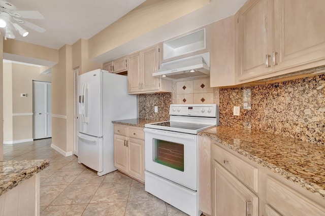 kitchen with light stone countertops, tasteful backsplash, white appliances, range hood, and light tile patterned flooring