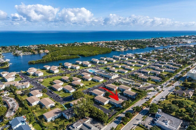 drone / aerial view with a residential view and a water view