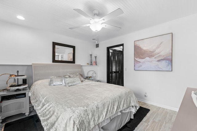 bedroom featuring ceiling fan and light hardwood / wood-style flooring