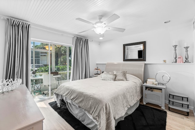 bedroom featuring access to outside, light hardwood / wood-style floors, and ceiling fan