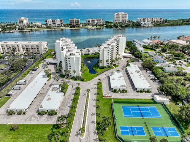 birds eye view of property featuring a view of city and a water view