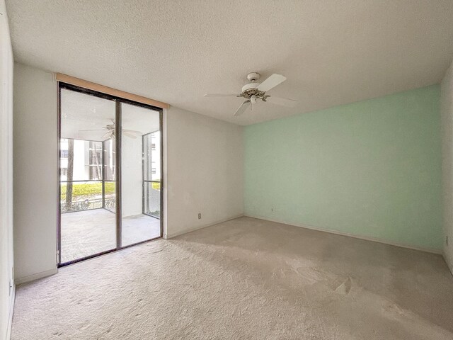 workout area featuring an AC wall unit, recessed lighting, and baseboards