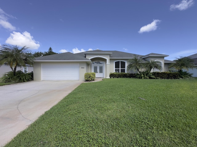 single story home with a garage and a front yard