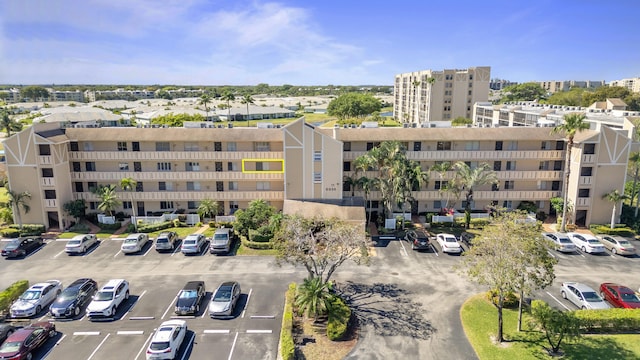 view of property with uncovered parking