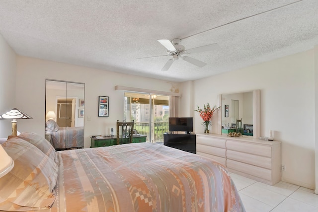 bedroom featuring a textured ceiling, access to exterior, ceiling fan, and light tile patterned flooring