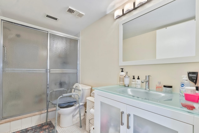 full bath with toilet, vanity, a shower stall, tile patterned flooring, and visible vents