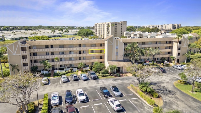 view of property featuring uncovered parking